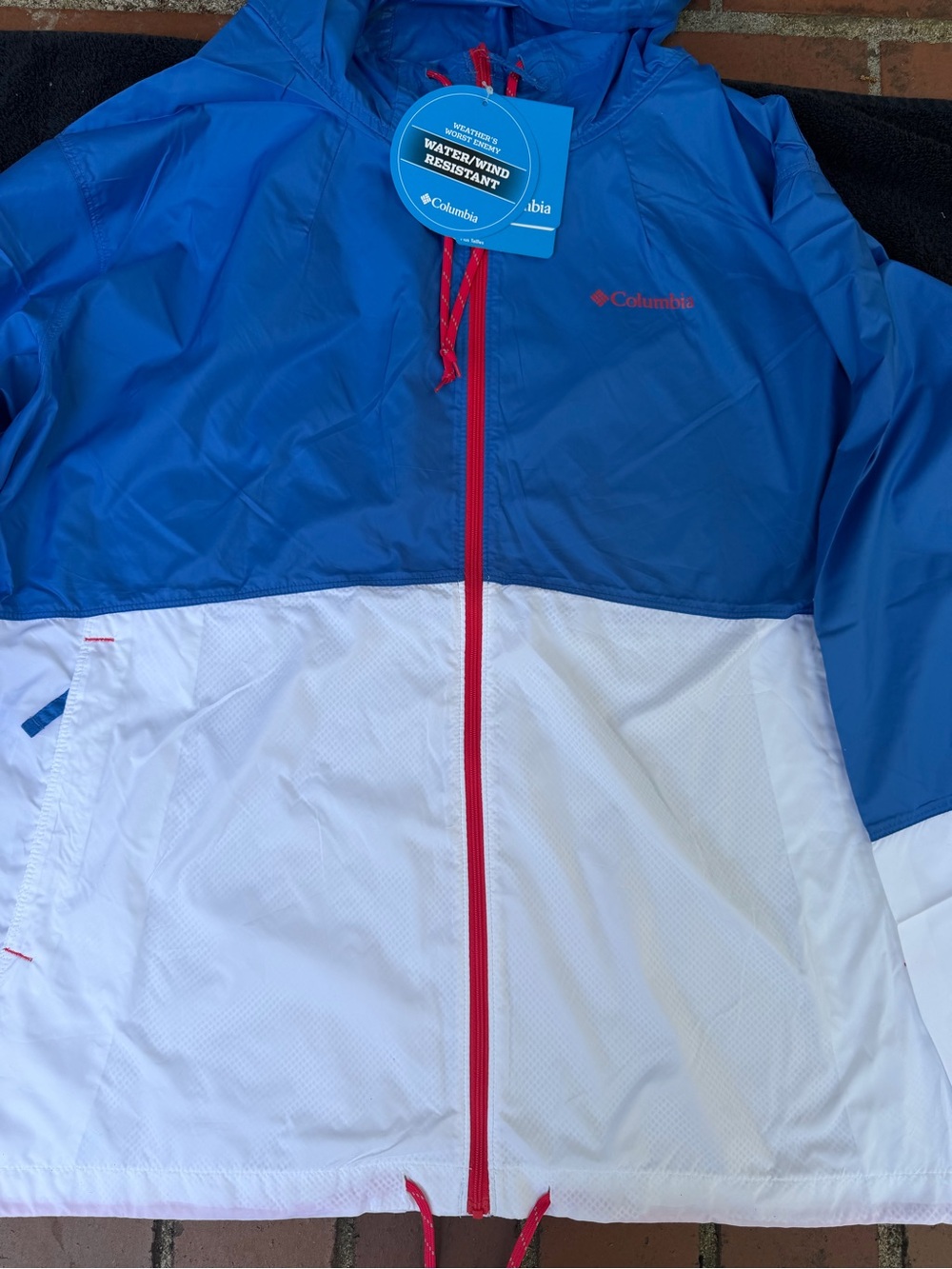 Columbia Blue Jacket with Red Trim and White Tag